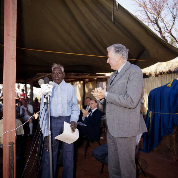 At a ceremony on 16 August 1975 Prime Minister Gough Whitlam handed title to land at Wattie Creek to Vincent Lingiari, spokesman for the Gurindji people.